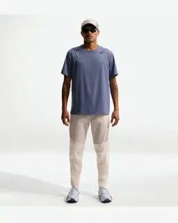 Pantalon tissé déperlant Nike Stride Homme – 1/4