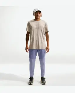 Pantalon tissé déperlant Nike Stride Homme – 1/4