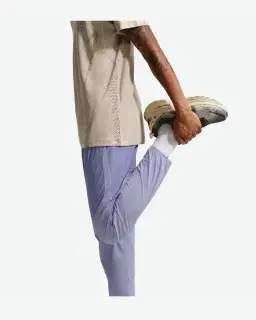 Pantalon tissé déperlant Nike Stride Homme – 4/4