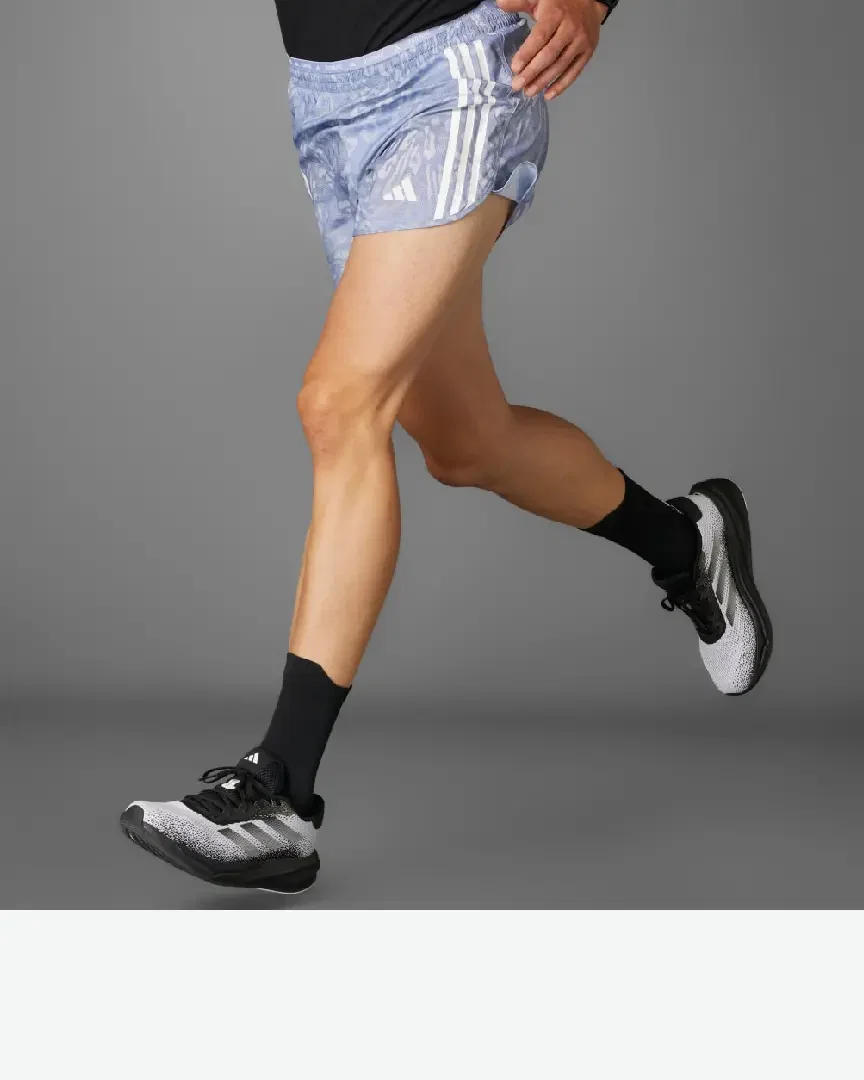 short adidas own the run 3 bandes Homme